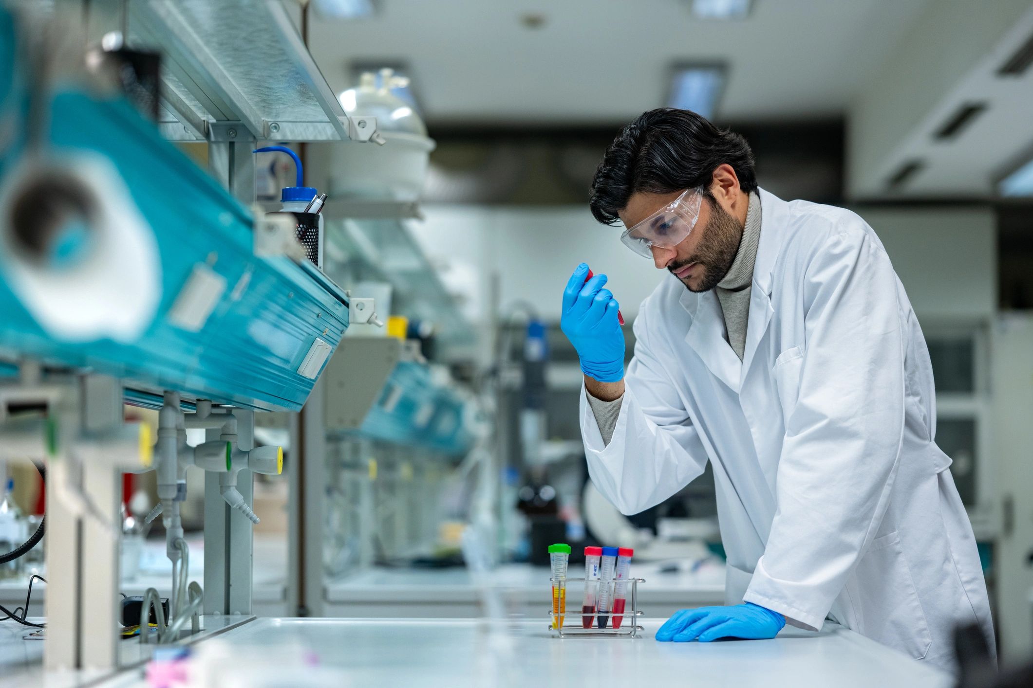 Scientist examining skin care formulations in a laboratory